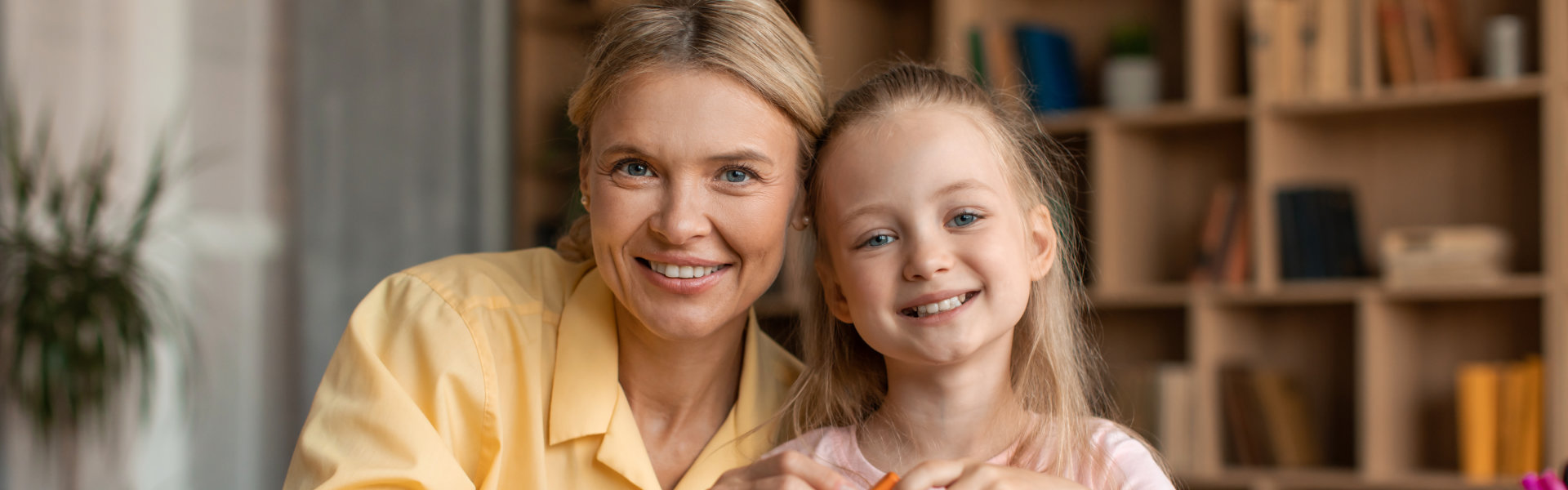 teacher and little girl smiling