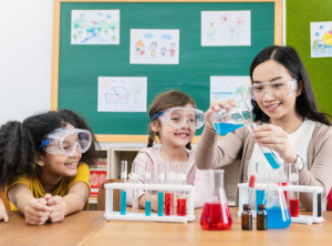 children doing a chemical experiment in laboratory at school